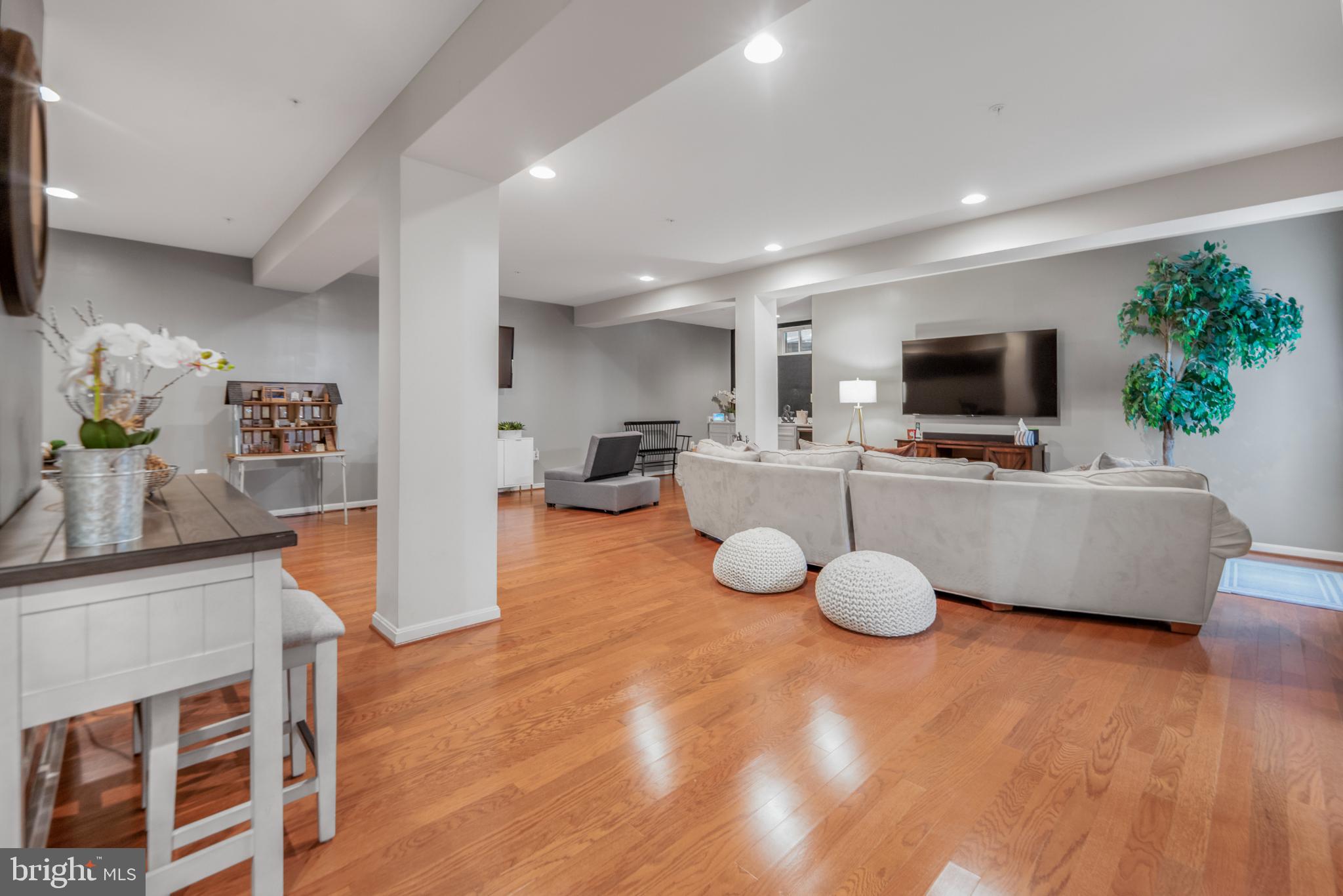 9709 Traver Street Bowie, MD 20721 - Photo 34 of 48 Spacious lower level area with warm wood floors.