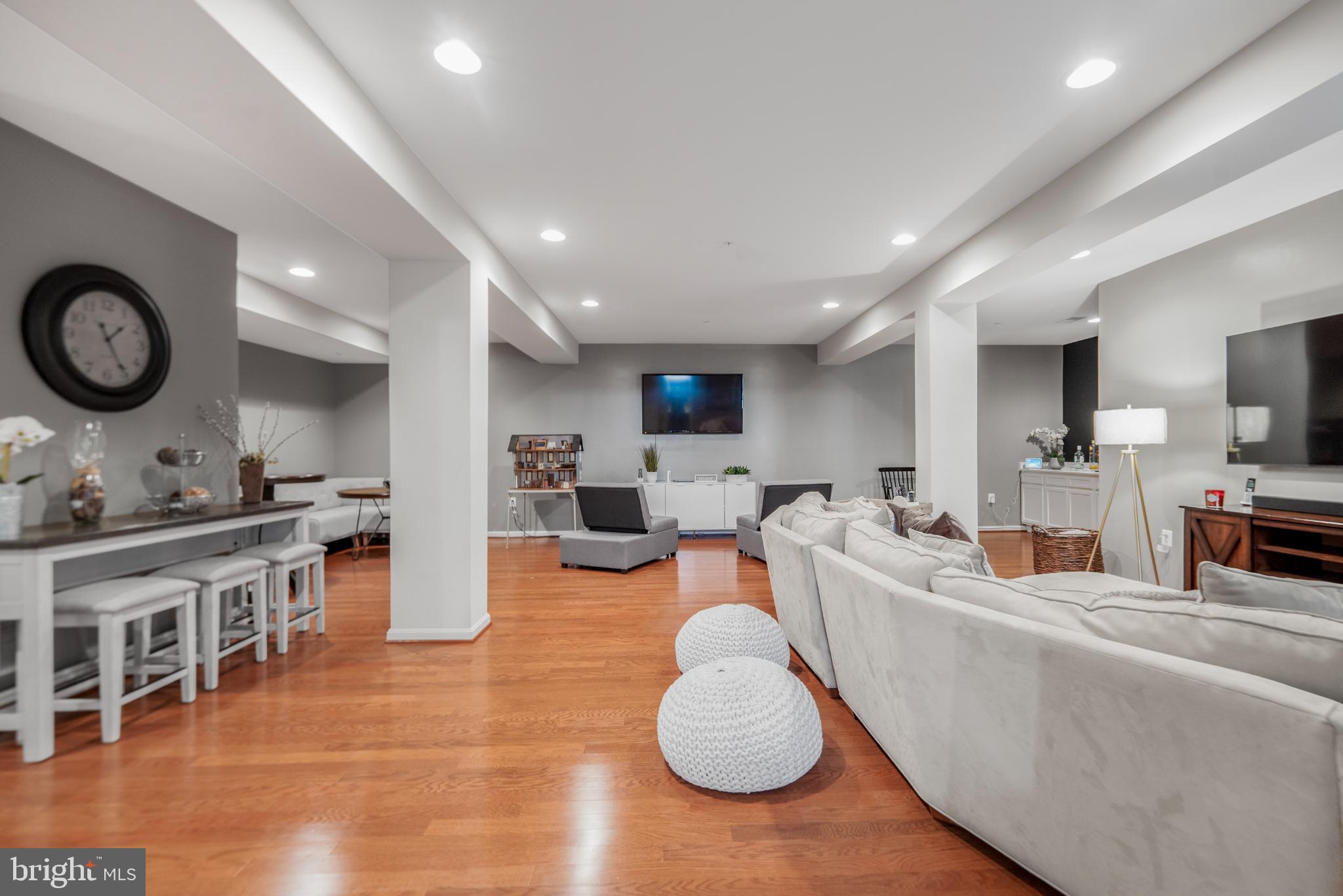 9709 Traver Street Bowie, MD 20721 - Photo 35 of 48 Spacious lower level area with warm wood floors.