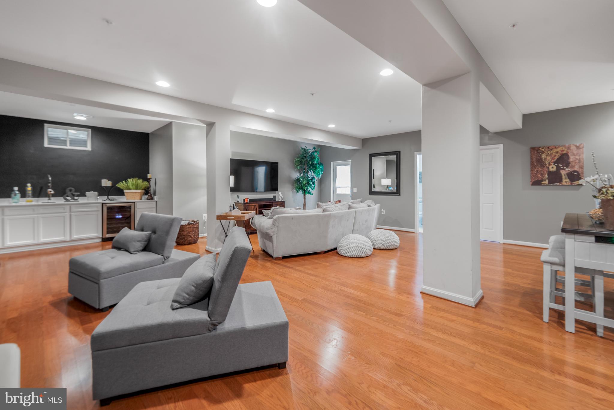 9709 Traver Street Bowie, MD 20721 - Photo 36 of 48 Spacious lower level area with warm wood floors.