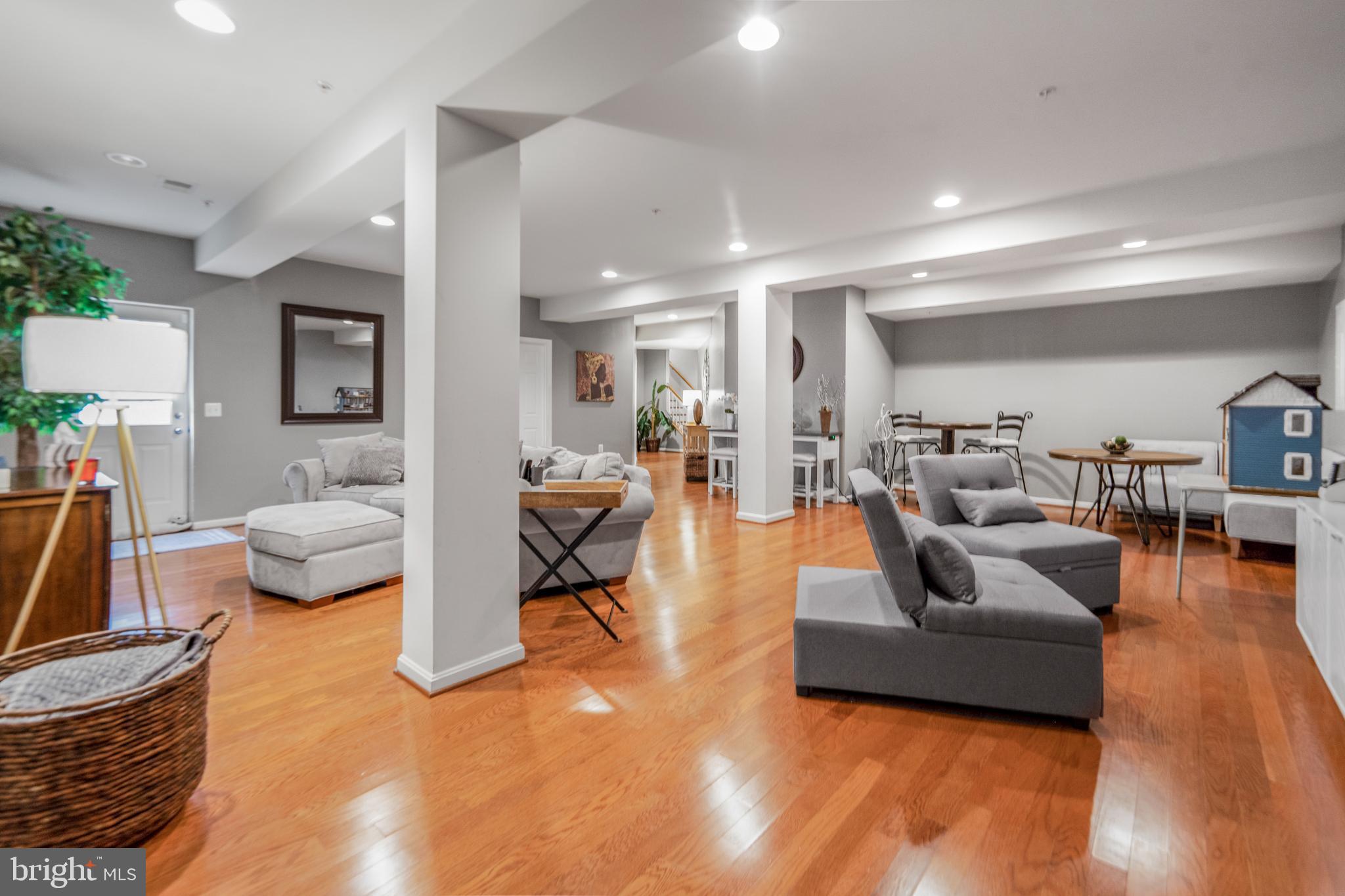 9709 Traver Street Bowie, MD 20721 - Photo 37 of 48 Spacious lower level area with warm wood floors.
