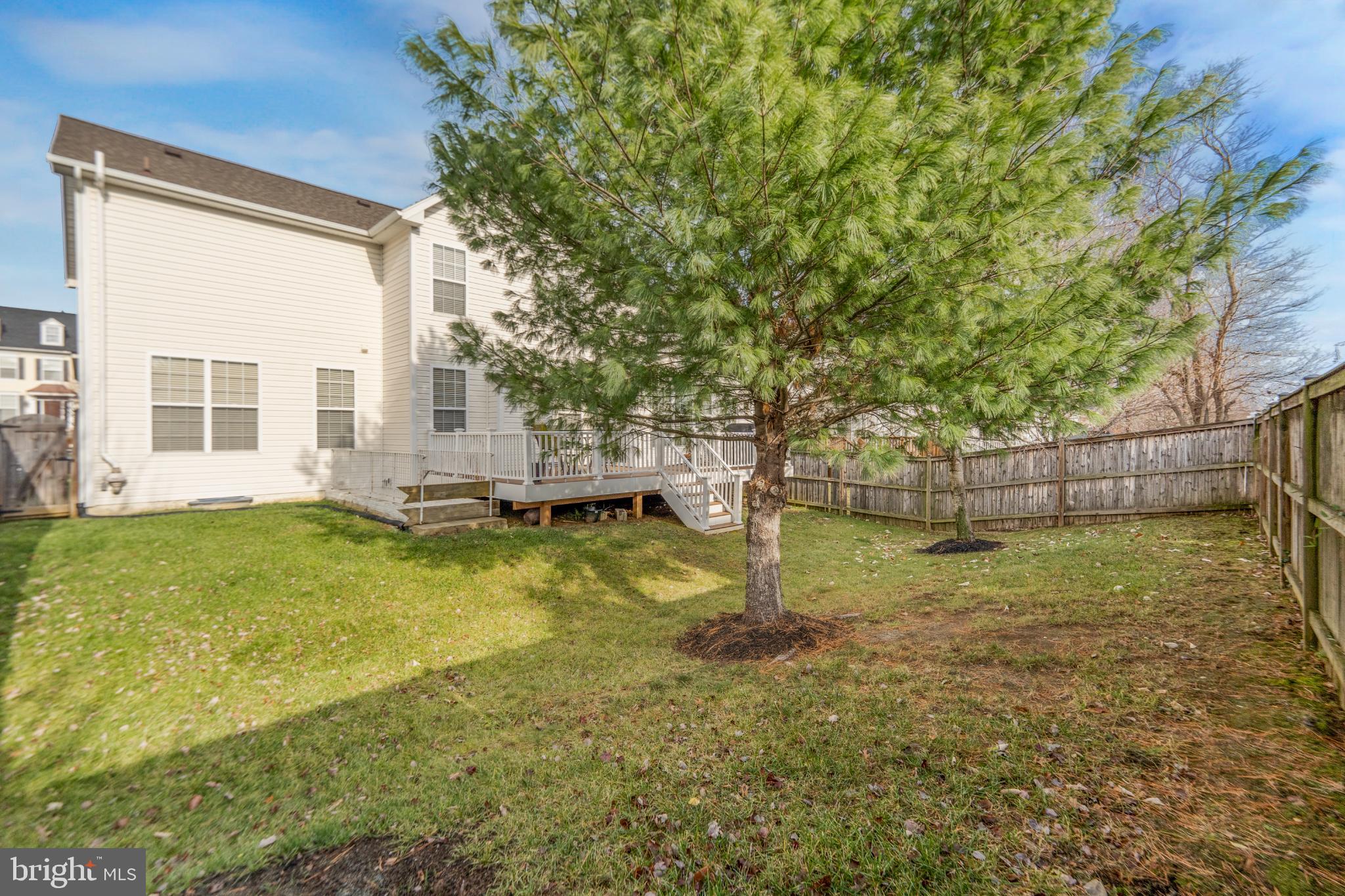 9709 Traver Street Bowie, MD 20721 - Photo 46 of 48 Spacious backyard with lush greenery.