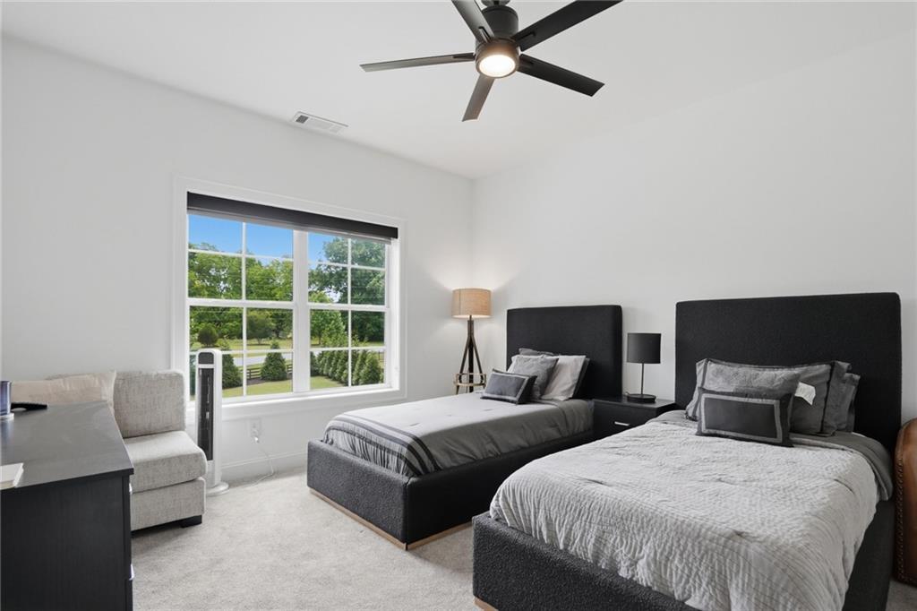 3020 Wallace Road Buford, GA 30519 - Photo 33 of 66 a bedroom with two beds and large window