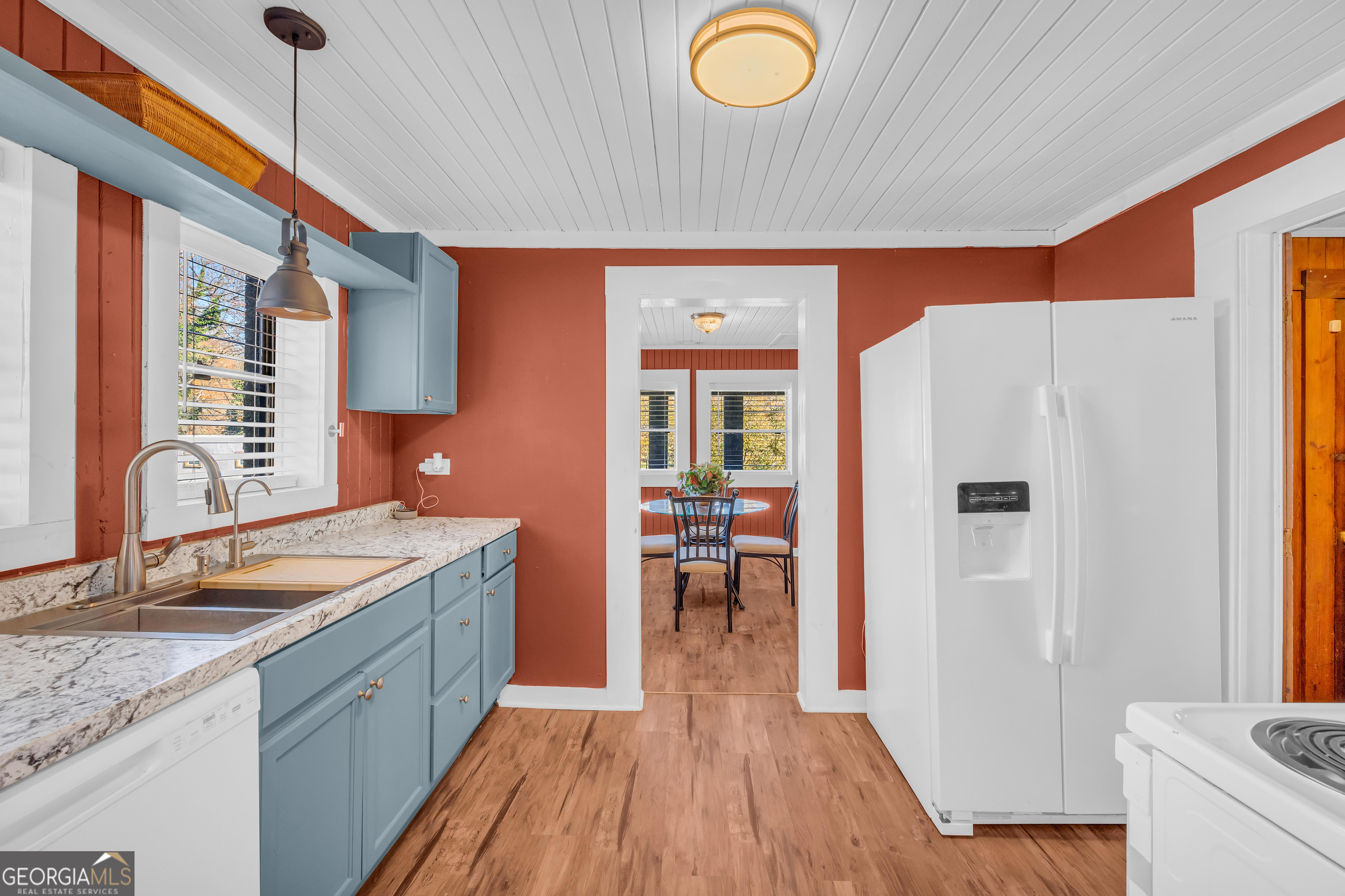 288 South Broad Street Toccoa, GA 30577 - Photo 12 of 23 a kitchen with a sink a refrigerator and wooden floor