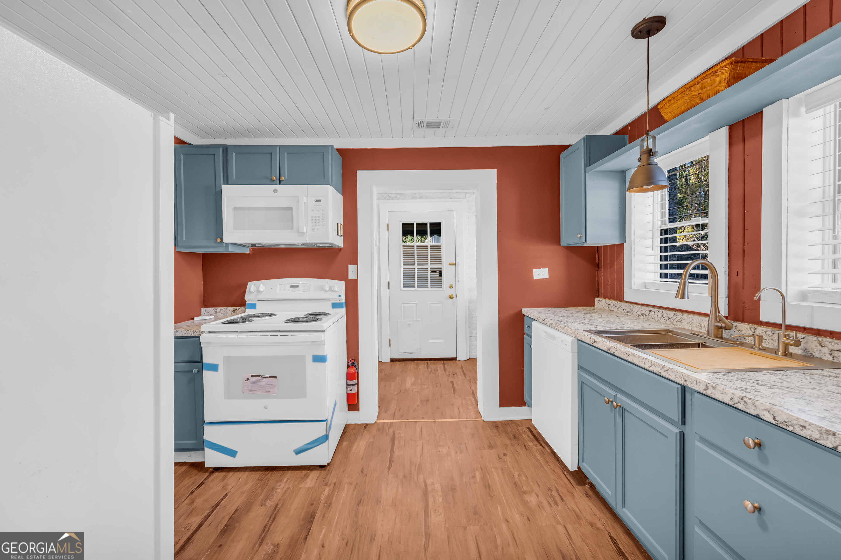288 South Broad Street Toccoa, GA 30577 - Photo 13 of 23 a kitchen with a sink cabinets and wooden floor