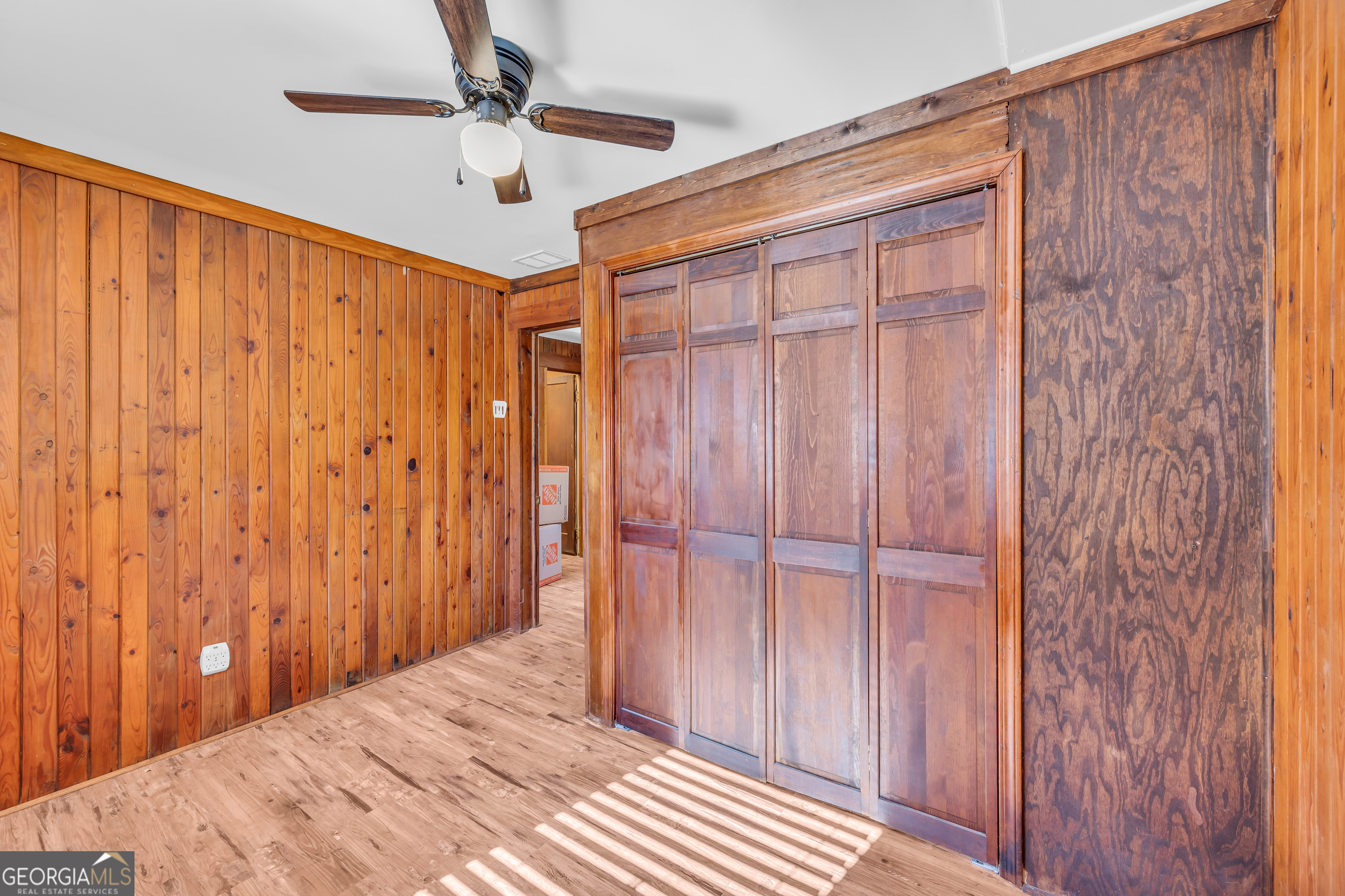 288 South Broad Street Toccoa, GA 30577 - Photo 18 of 23 a bedroom with a bed and a chandelier fan