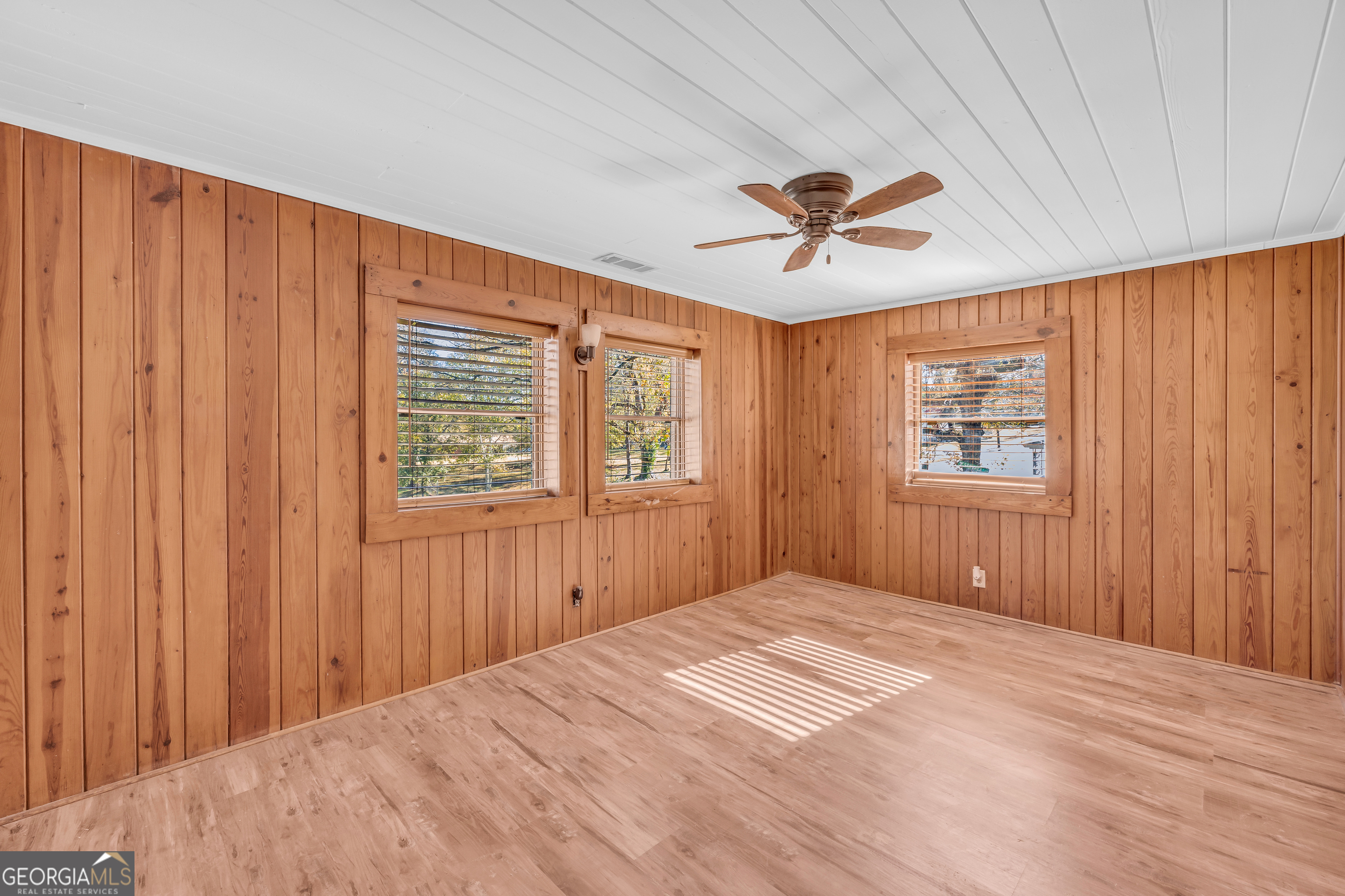 288 South Broad Street Toccoa, GA 30577 - Photo 8 of 23 a bedroom with a bed and a chandelier