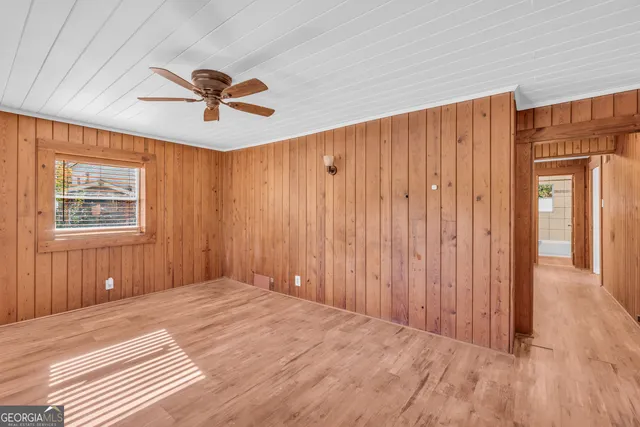a view of a room with a ceiling fan
