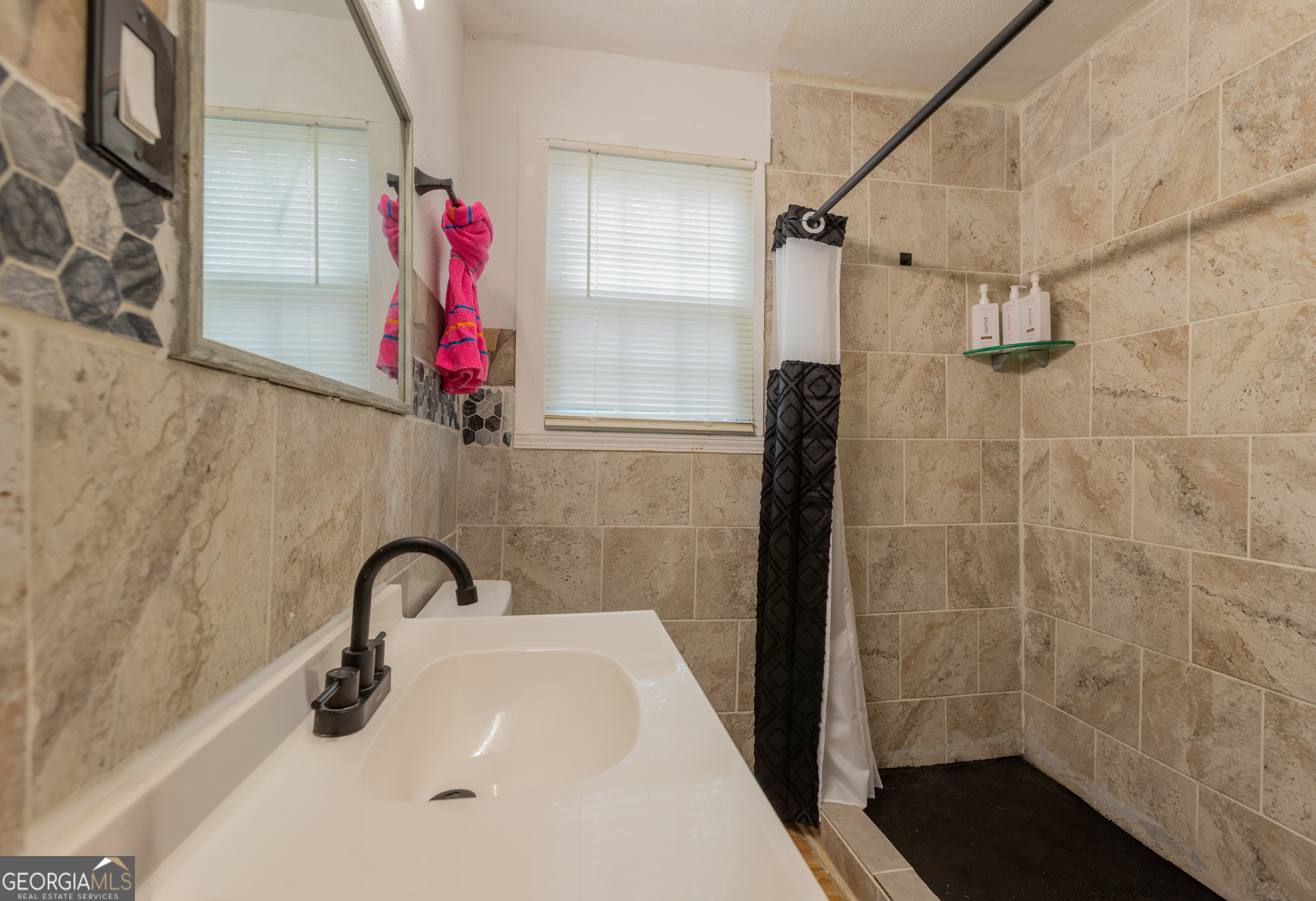 1103 Calvin Avenue Columbus, GA 31903 - Photo 11 of 15 a bathroom with a shower and a sink