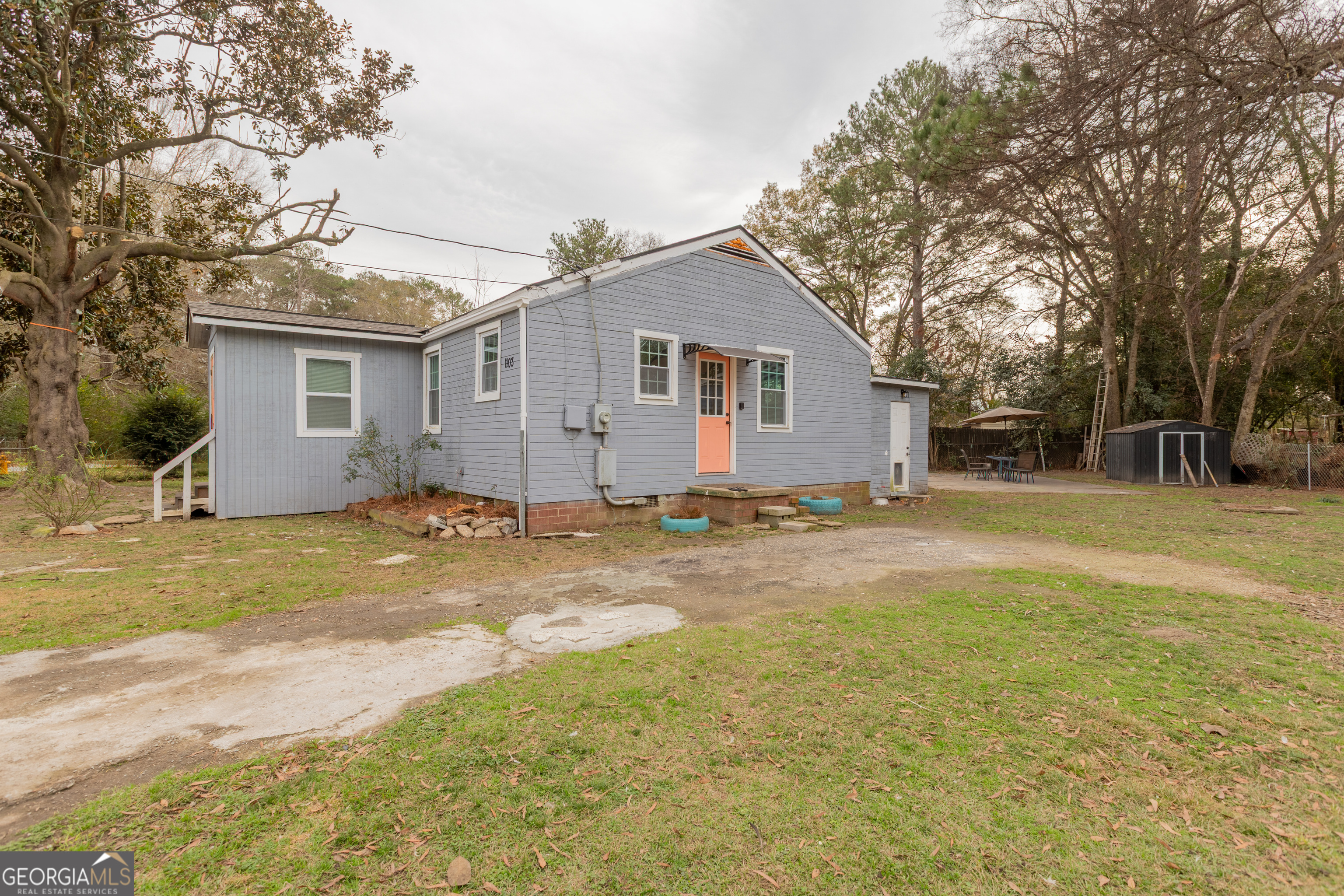 1103 Calvin Avenue Columbus, GA 31903 - Photo 3 of 15 a view of a house with a yard and large tree
