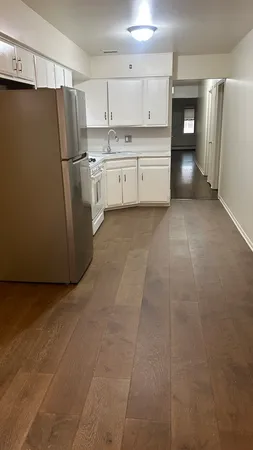 a kitchen with stainless steel appliances a refrigerator and a stove