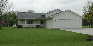 12169 Tresemer Road Roscoe, IL 61073 - Photo 1 of 1 a front view of house with a garden