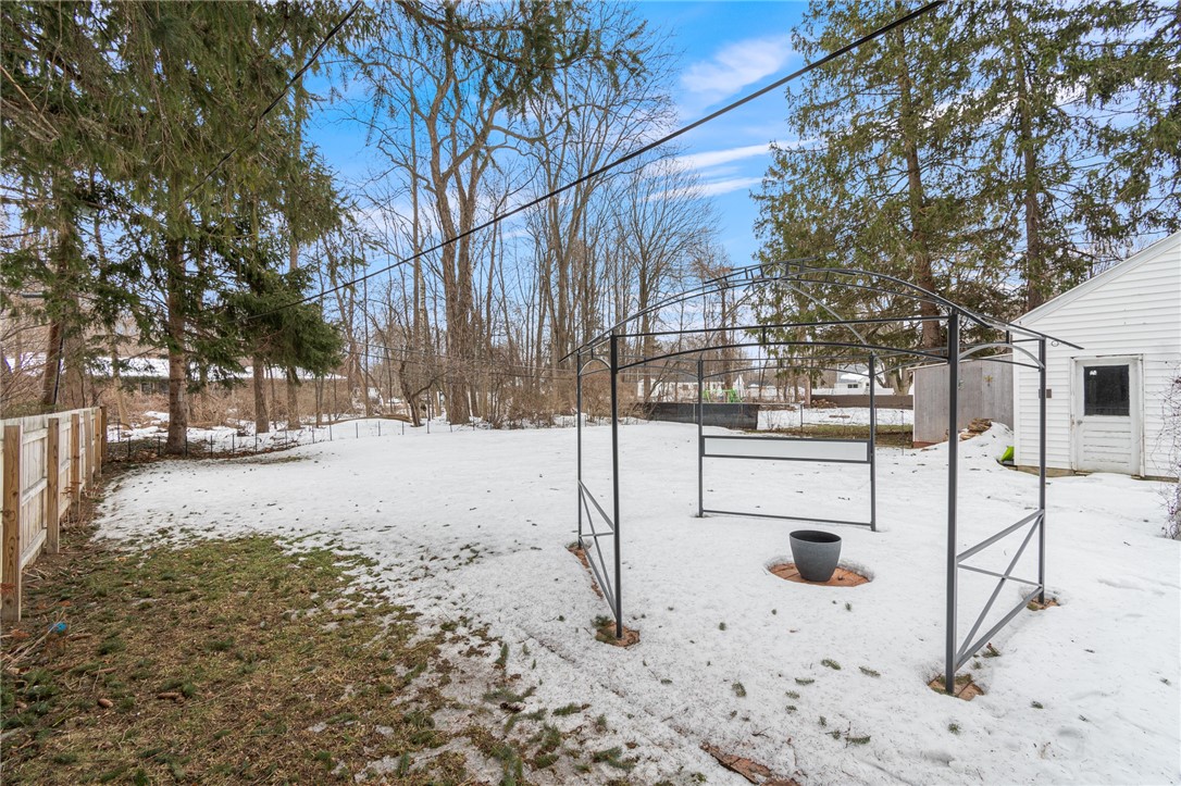 544 Glenview Court Webster, NY 14580 - Photo 27 of 31 The private yard- the canopied deck is coveted spo