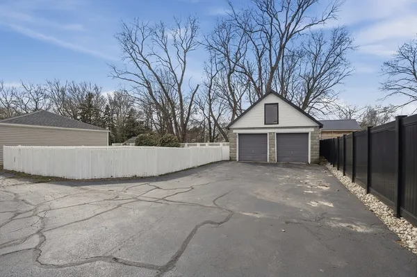 a view of house with trees in front of it