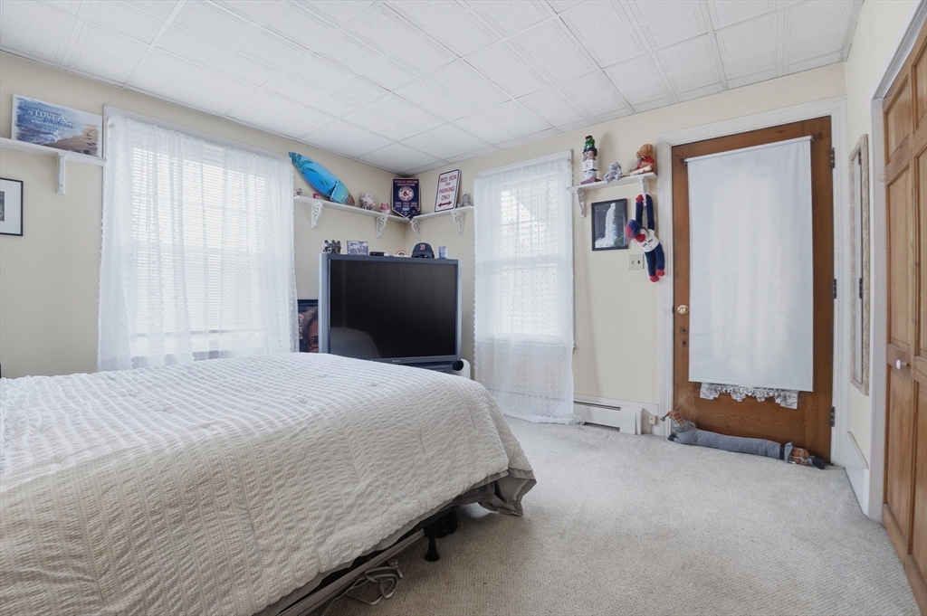 203 South Main Street Acushnet, MA 02743 - Photo 21 of 34 a bedroom with a bed and a window