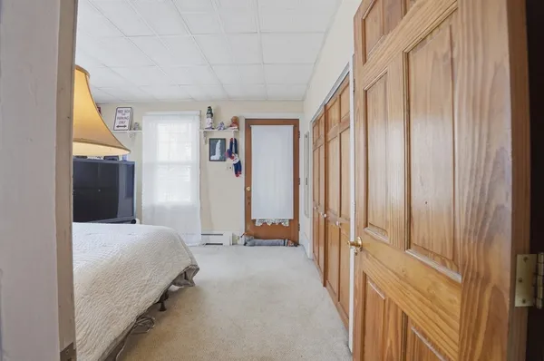 a view of a bedroom with closet area