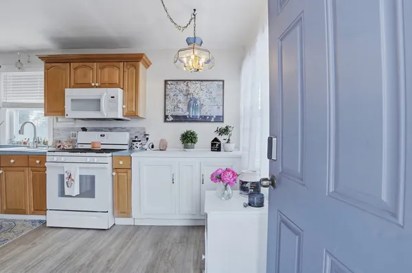 a utility room with cabinets a washer and dryer