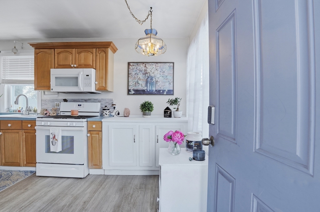 203 South Main Street Acushnet, MA 02743 - Photo 3 of 34 a utility room with cabinets a washer and dryer