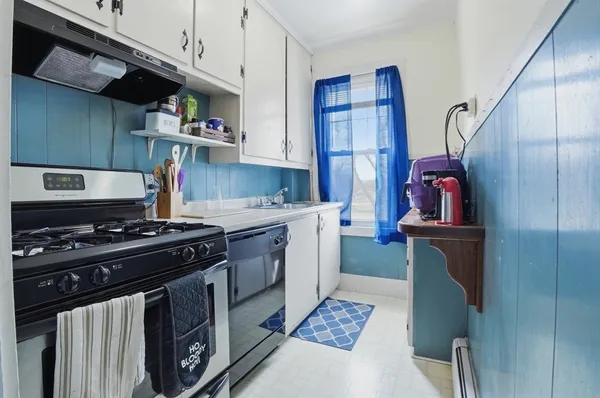 a kitchen with a stove and a refrigerator