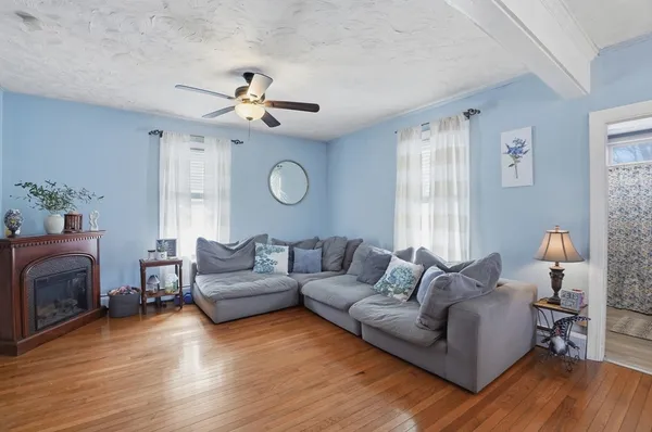 a living room with furniture and a fireplace