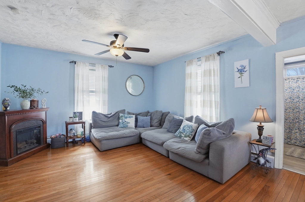 203 South Main Street Acushnet, MA 02743 - Photo 4 of 34 a living room with furniture and a fireplace
