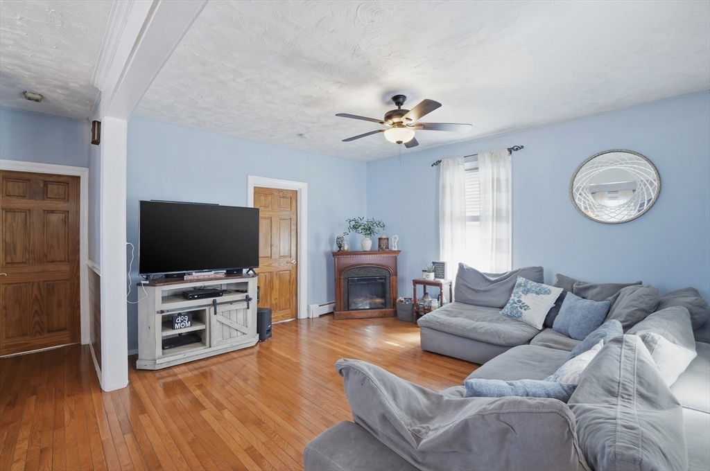 203 South Main Street Acushnet, MA 02743 - Photo 7 of 34 a living room with furniture and a flat screen tv