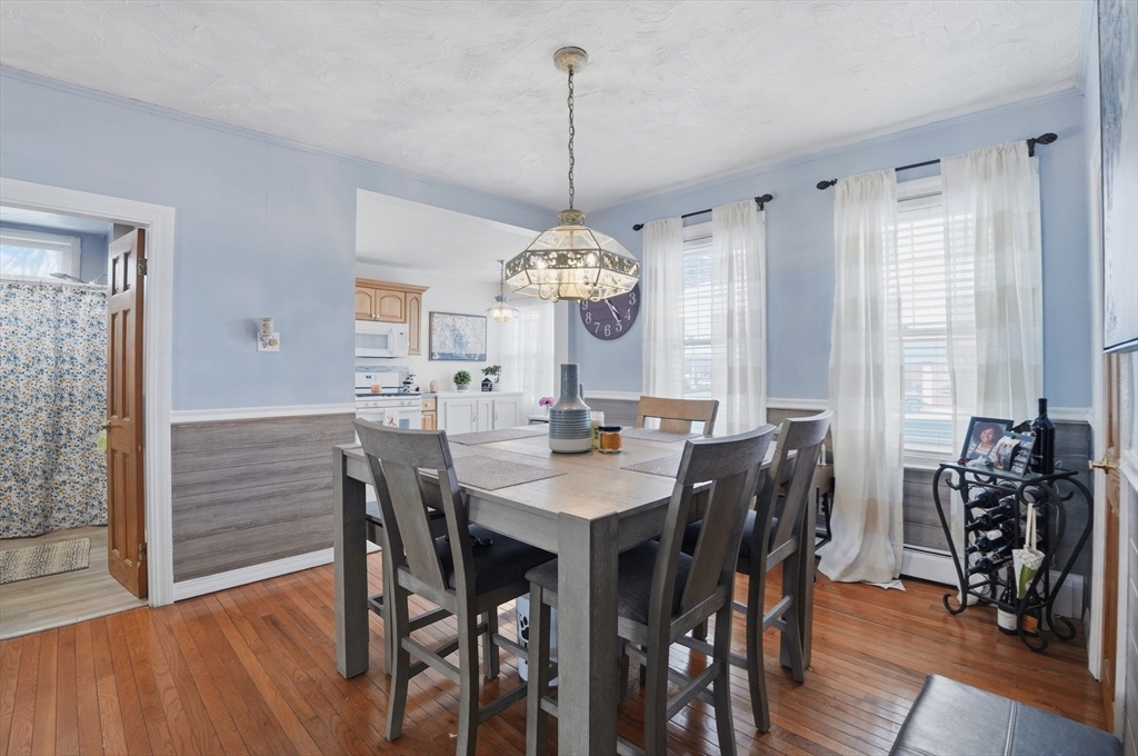 203 South Main Street Acushnet, MA 02743 - Photo 10 of 34 a view of a dining room with furniture window and wooden floor