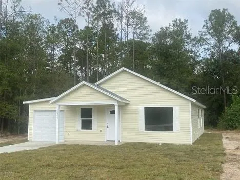 a front view of a house with garage