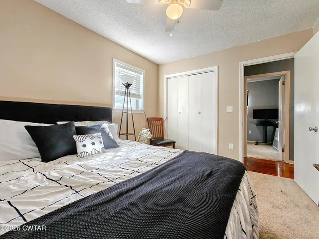 a view of a house with backyard and tub