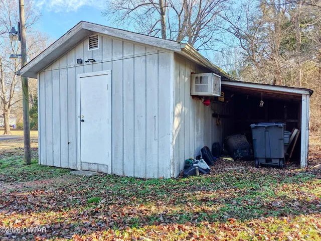 a wooden door in front of a house