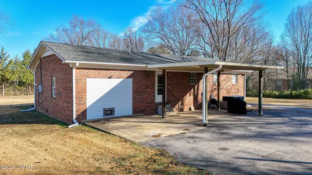 a view of the house with large windows