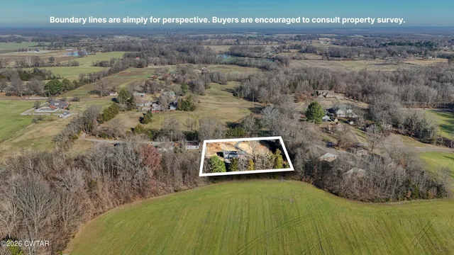 a view of a swimming pool with a yard