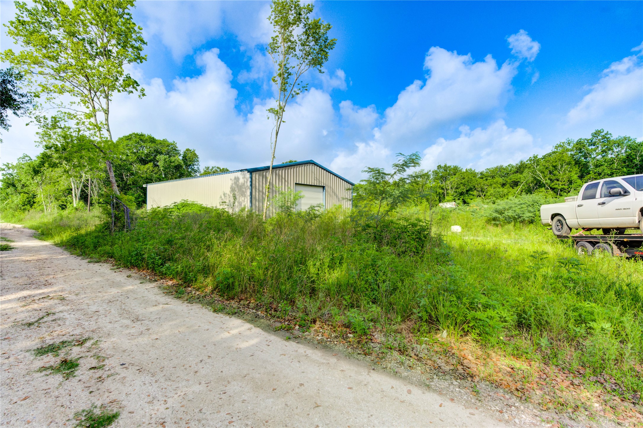 19650 Webb Alvin, TX 77511 - Photo 5 of 19 a view of a garden with a building in the background