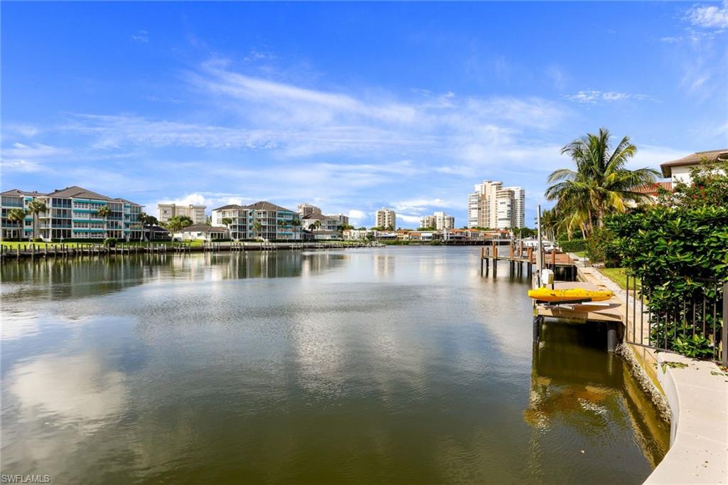 4155 Crayton Road, Unit 108 Naples, FL 34103 - Photo 24 of 32 a view of a lake with boats