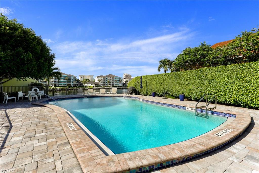 4155 Crayton Road, Unit 108 Naples, FL 34103 - Photo 25 of 32 a view of a swimming pool and outdoor space