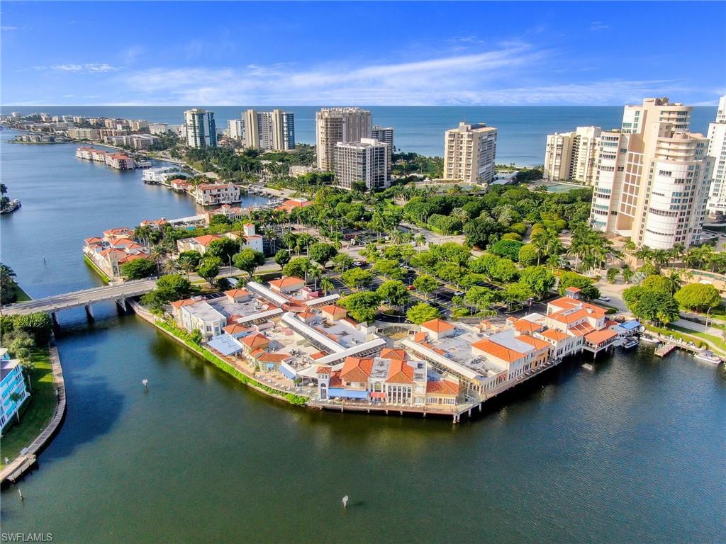4155 Crayton Road, Unit 108 Naples, FL 34103 - Photo 29 of 32 a view of a city with tall buildings