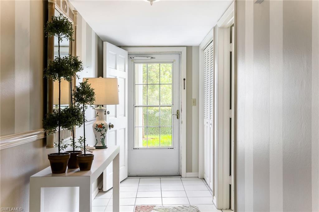 4155 Crayton Road, Unit 108 Naples, FL 34103 - Photo 3 of 32 a bathroom with a bathtub and a window