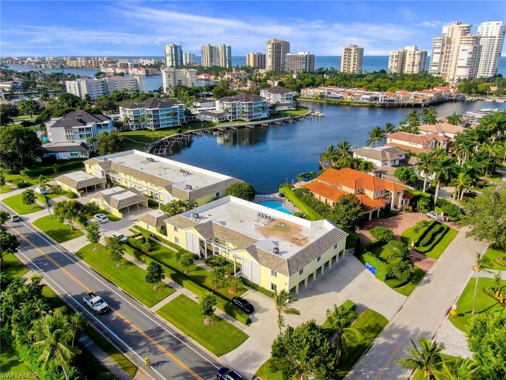 4155 Crayton Road, Unit 108 Naples, FL 34103 - Photo 32 of 32 a view of a lake with a city