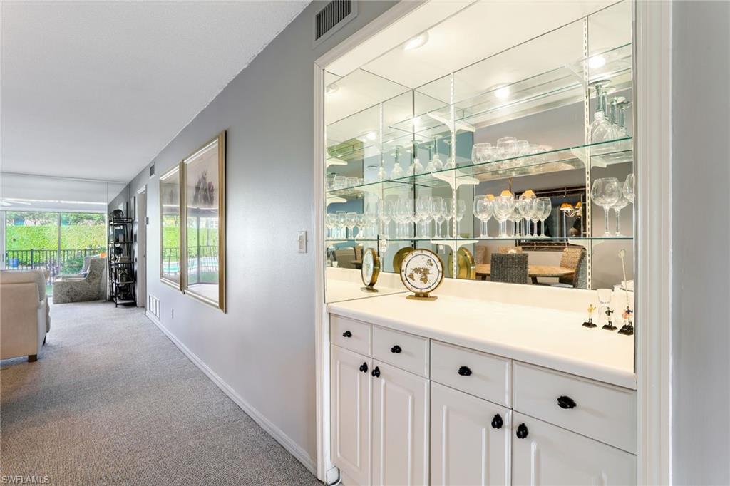 4155 Crayton Road, Unit 108 Naples, FL 34103 - Photo 8 of 32 a room with a large window and sink
