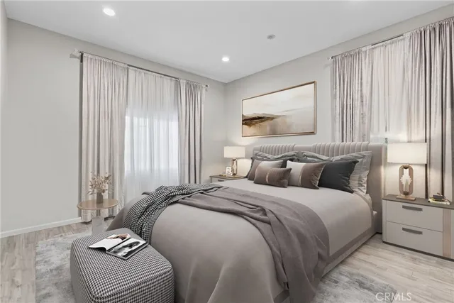 a bedroom with bed and window