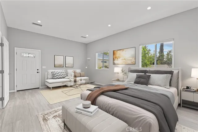 a bedroom with a bed and a couch