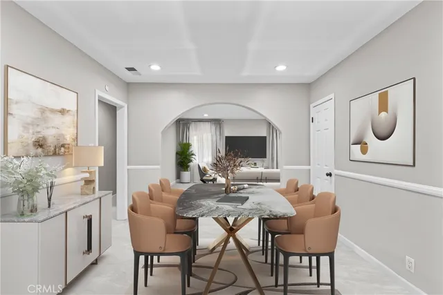 a dining room with furniture and window