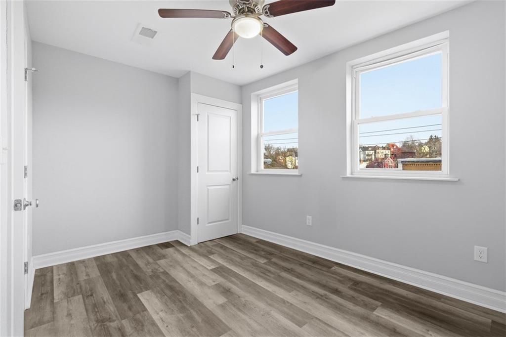 714 Cherokee Street Pittsburgh, PA 15219 - Photo 17 of 26 a view of empty room with wooden floor