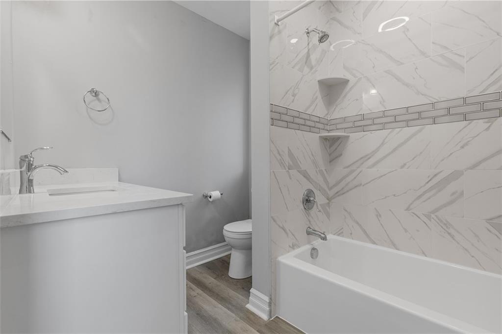 714 Cherokee Street Pittsburgh, PA 15219 - Photo 18 of 26 a bathroom with a sink a toilet and bathtub