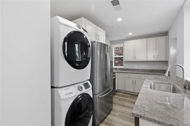 a kitchen with a washer and dryer