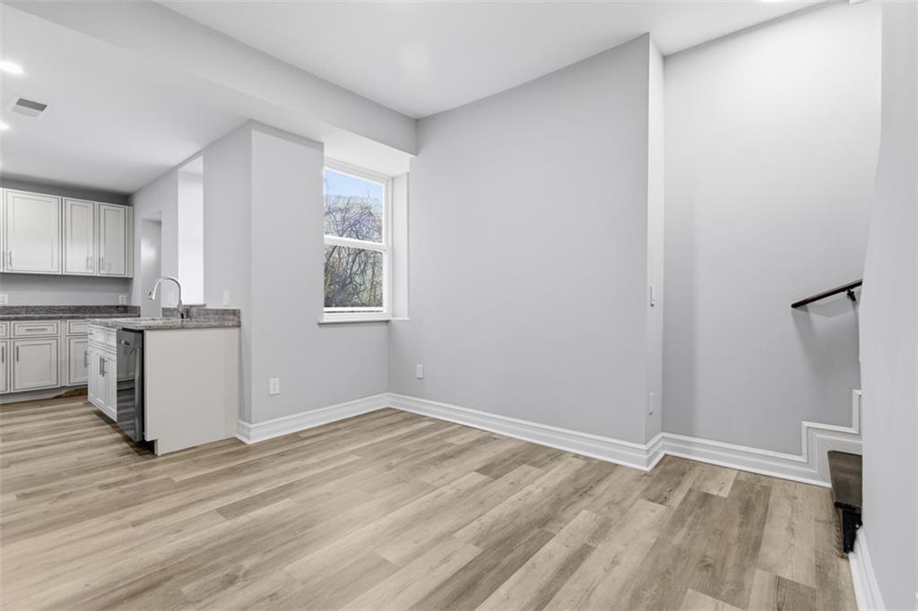714 Cherokee Street Pittsburgh, PA 15219 - Photo 10 of 26 a view of empty room with wooden floor and window