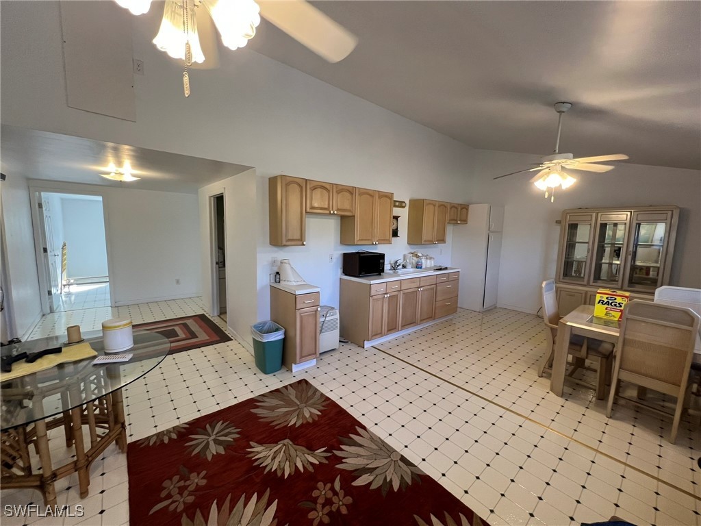 46920 A Bermont Road Punta Gorda, FL 33982 - Photo 33 of 40 a bedroom with a bed a table and chair