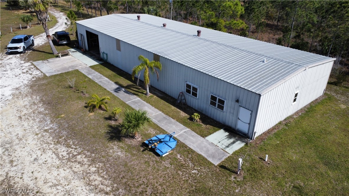 46920 A Bermont Road Punta Gorda, FL 33982 - Photo 4 of 40 a view of a backyard with a sitting area