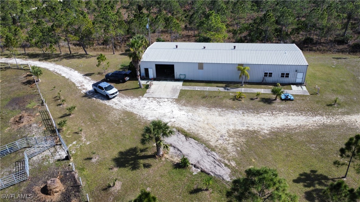 46920 A Bermont Road Punta Gorda, FL 33982 - Photo 6 of 40 a aerial view of a house with a yard