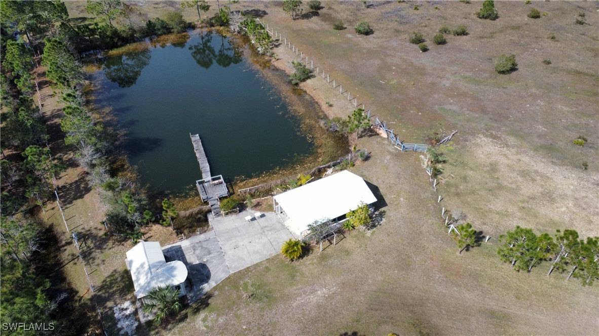 46920 A Bermont Road Punta Gorda, FL 33982 - Photo 8 of 40 an aerial view of a house with a yard