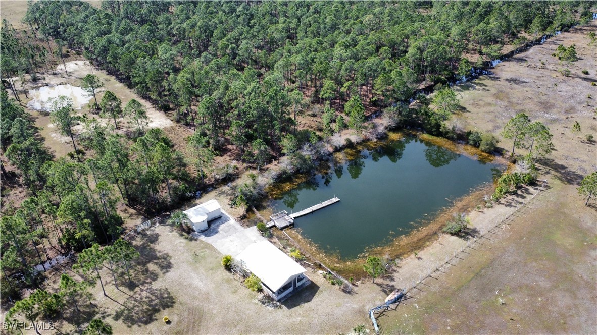 46920 A Bermont Road Punta Gorda, FL 33982 - Photo 9 of 40 an aerial view of house with yard swimming pool and outdoor seating